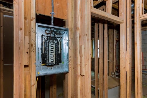HVAC technician servicing a home air conditioning unit